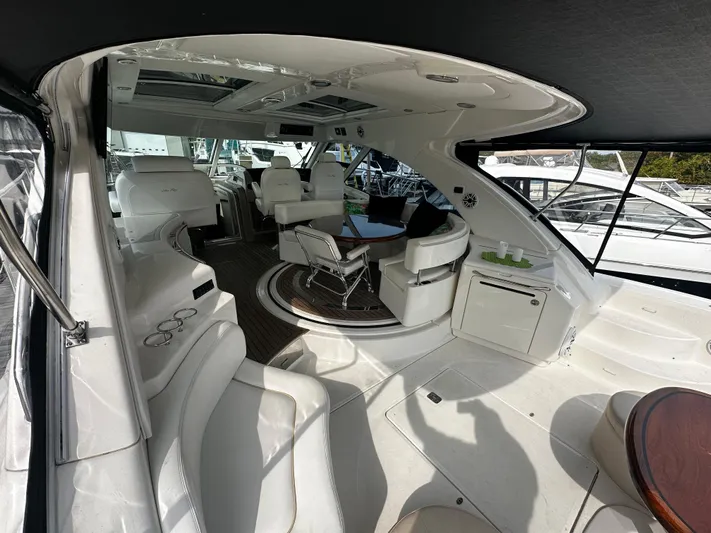 Man O War Yacht Photos Pics Luxurious interior of a 2009 Sea Ray 580 Sundancer yacht with elegant seating and modern design.