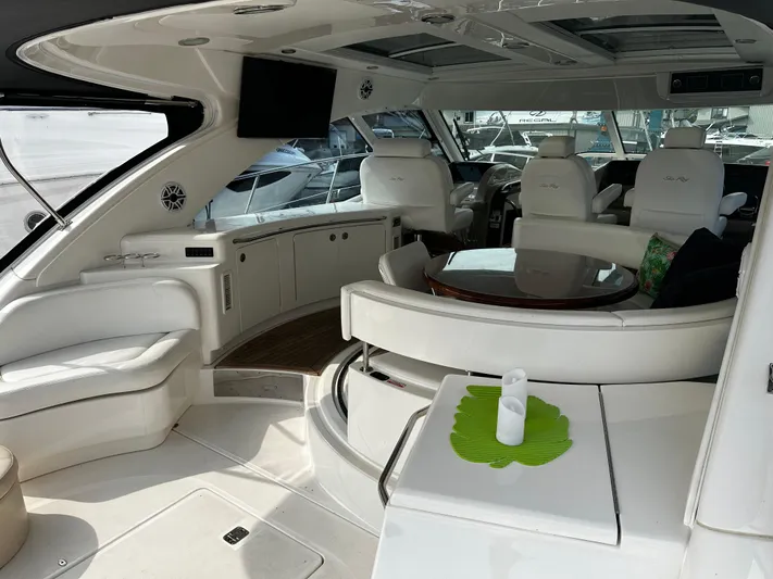Man O War Yacht Photos Pics Luxurious interior of 2009 Sea Ray 580 Sundancer yacht with elegant seating and modern amenities.