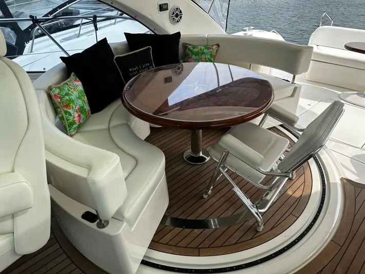 Man O War Yacht Photos Pics Luxurious 2009 Sea Ray 580 Sundancer yacht interior with elegant seating and wooden table.
