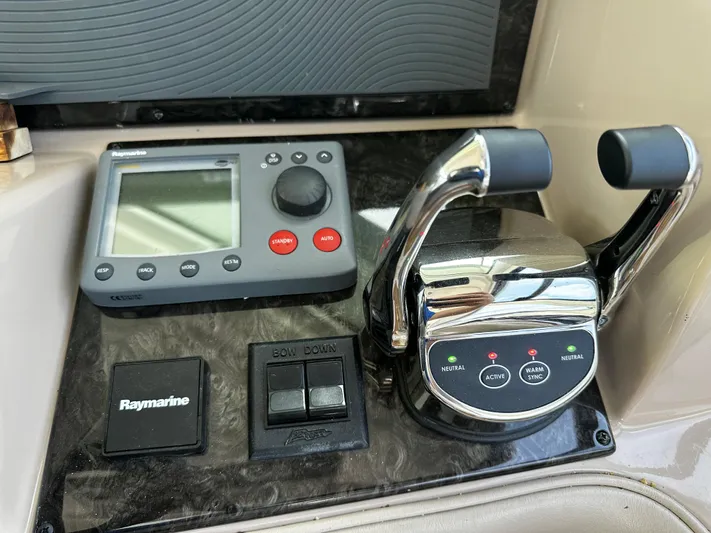 Man O War Yacht Photos Pics Control panel of 2009 Sea Ray 580 Sundancer with Raymarine equipment and throttle levers.