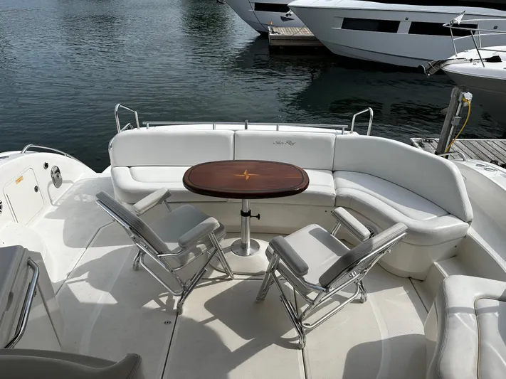 Man O War Yacht Photos Pics 2009 Sea Ray 580 Sundancer yacht with elegant seating and table on deck.