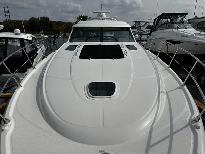 Man O War Yacht Photos Pics 2009 Sea Ray 580 Sundancer yacht docked, showcasing sleek white deck design.