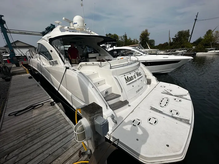 Man O War Yacht Photos Pics 2009 Sea Ray 580 Sundancer yacht docked at marina, rear view.
