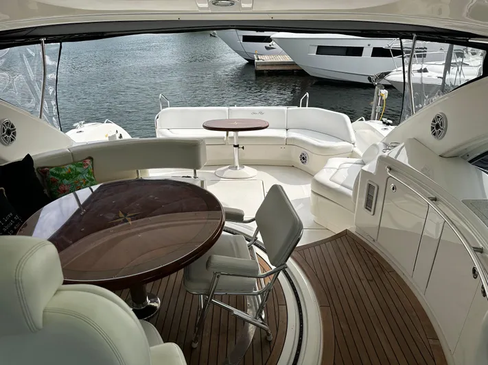 Man O War Yacht Photos Pics Luxurious 2009 Sea Ray 580 Sundancer yacht interior with elegant seating and wooden flooring.