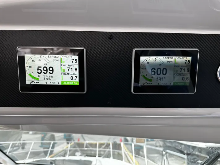 Man O War Yacht Photos Pics Digital displays on a 2009 Sea Ray 580 Sundancer showing engine RPM and temperature.