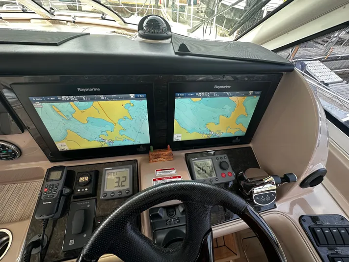 Man O War Yacht Photos Pics Helm of 2009 Sea Ray 580 Sundancer with dual Raymarine navigation displays.