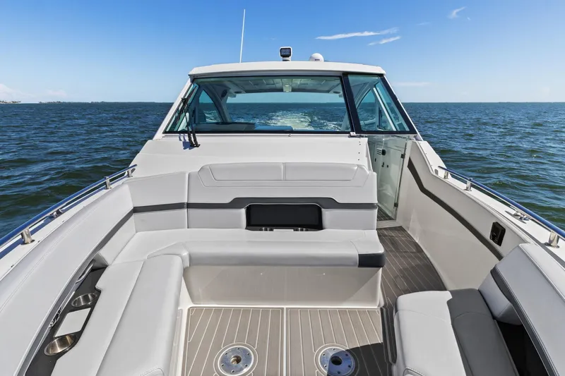  Yacht Photos Pics 2023 Formula 380 Super Sport Crossover OB cruising on open water, showcasing spacious seating.