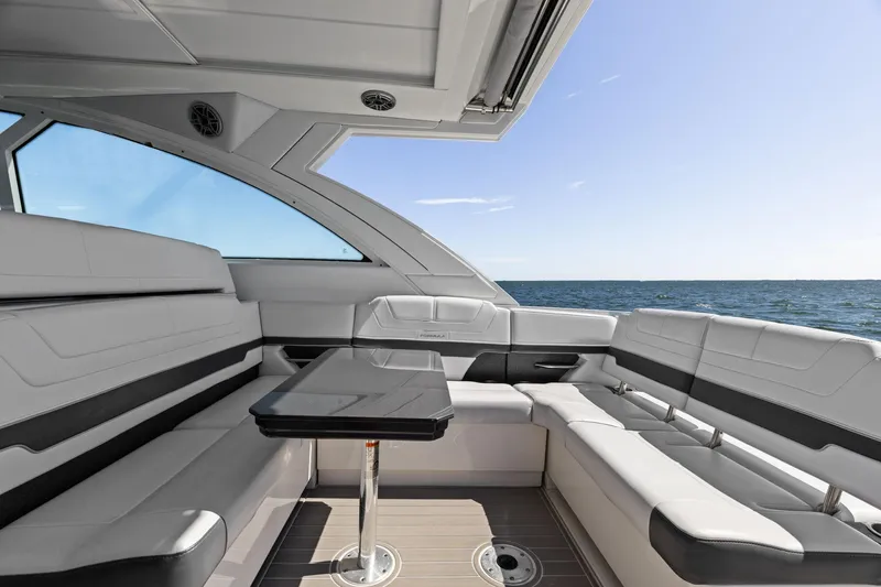  Yacht Photos Pics 2023 Formula 380 Super Sport Crossover OB interior with luxurious seating and ocean view.