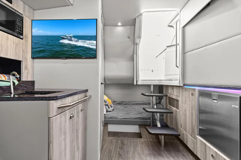  Yacht Photos Pics Interior of 2023 Formula 380 Super Sport Crossover OB, featuring modern kitchen and cozy sleeping area.