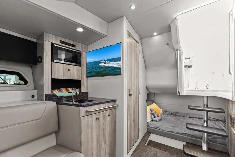  Yacht Photos Pics Interior of 2023 Formula 380 Super Sport Crossover OB, featuring modern amenities and cozy sleeping area.