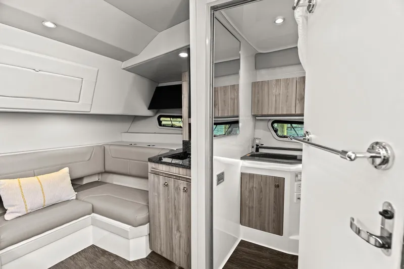  Yacht Photos Pics 2023 Formula 380 Super Sport Crossover OB interior with modern seating and kitchenette.