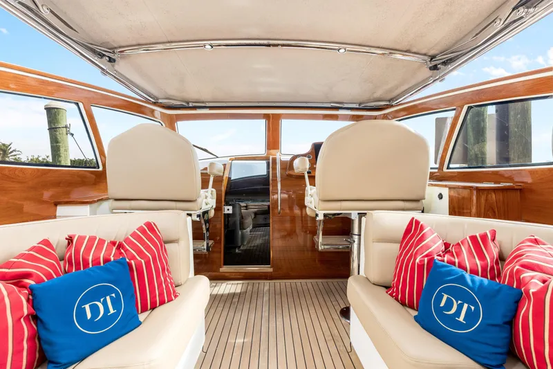 Tanacity Yacht Photos Pics Luxurious 2009 Hinckley Runabout 38 interior with plush seating and vibrant cushions.