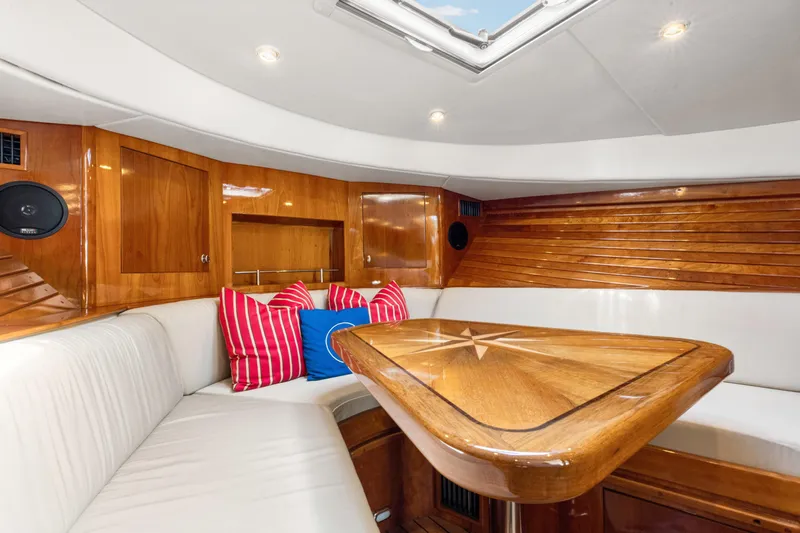 Tanacity Yacht Photos Pics Luxurious interior of 2009 Hinckley Runabout 38 with wood accents and plush seating.