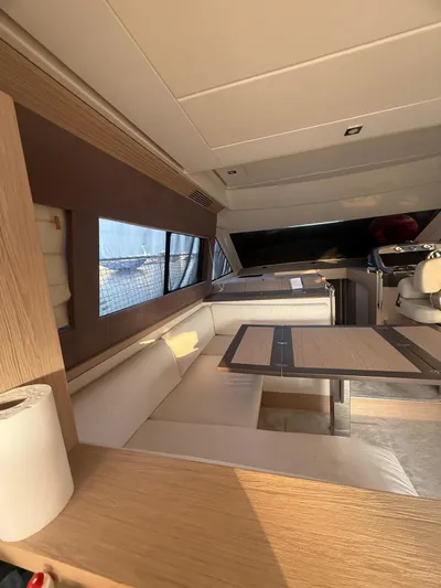  Yacht Photos Pics Interior of 2018 Beneteau Monte Carlo 5 yacht with modern seating and dining area.