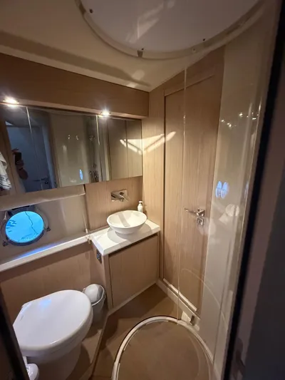  Yacht Photos Pics Luxurious bathroom in 2018 Beneteau Monte Carlo 5 yacht, featuring modern fixtures and elegant design.