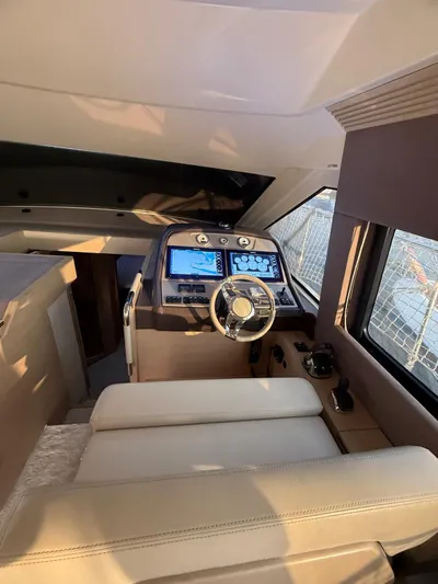  Yacht Photos Pics 2018 Beneteau Monte Carlo 5 helm with modern navigation displays and luxurious seating.