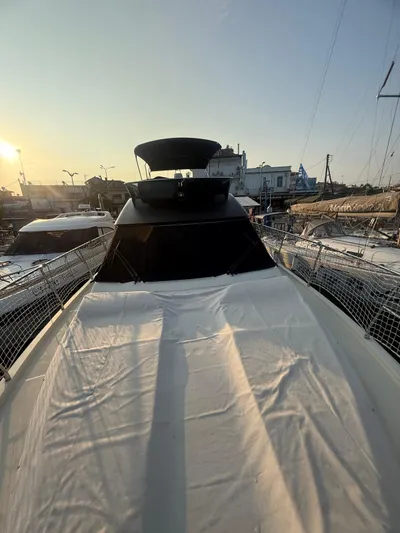  Yacht Photos Pics 2018 Beneteau Monte Carlo 5 yacht at sunset, docked in a marina.