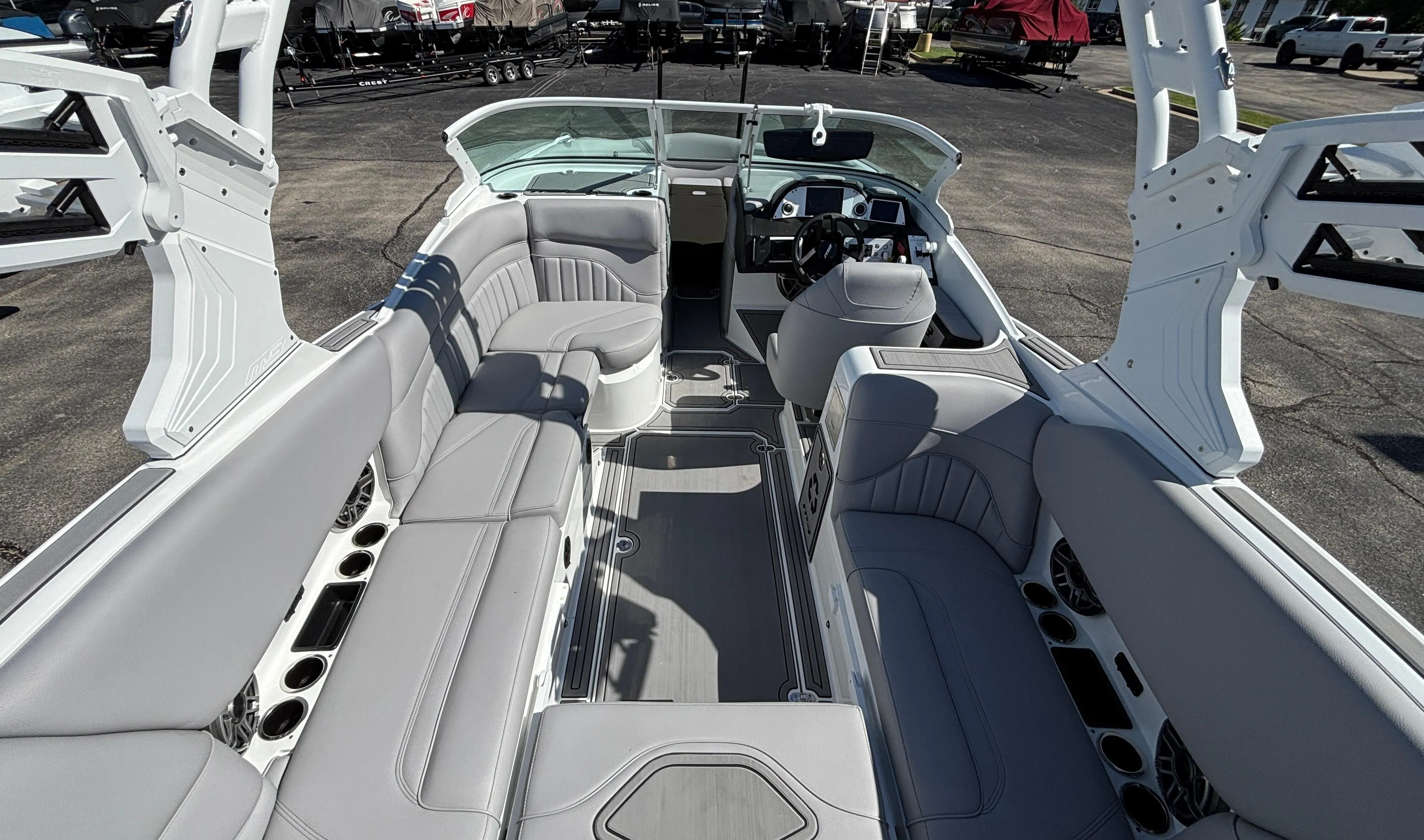 2025 MB B52 25 Alpha boat interior with sleek gray seating and modern dashboard.