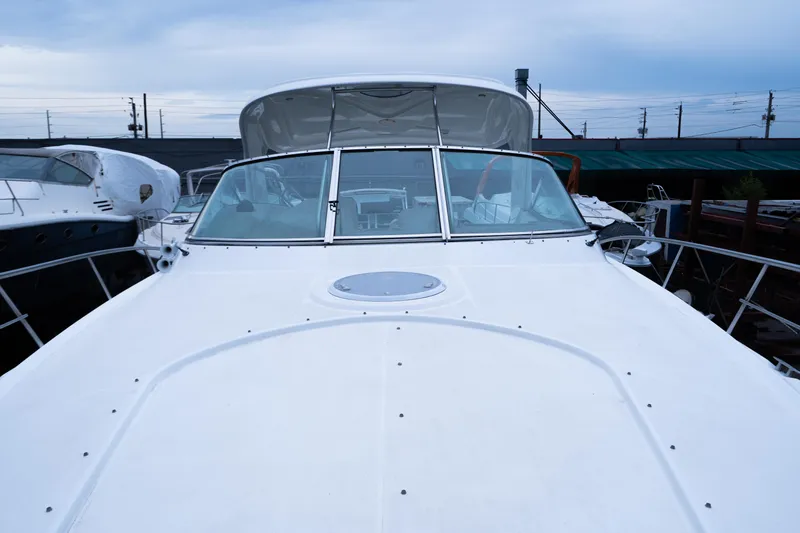  Yacht Photos Pics 2008 Cruisers 420 Express yacht, front view, docked under cloudy sky.
