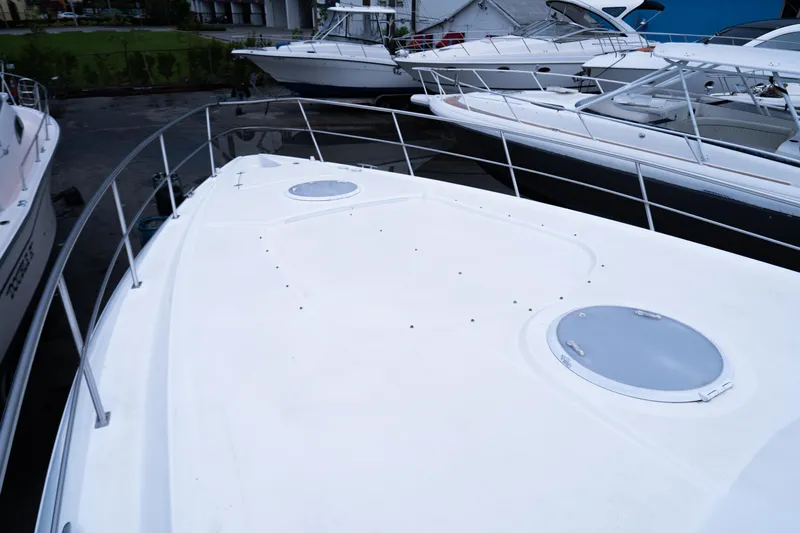  Yacht Photos Pics 2008 Cruisers 420 Express yacht docked with sleek white deck and railing.