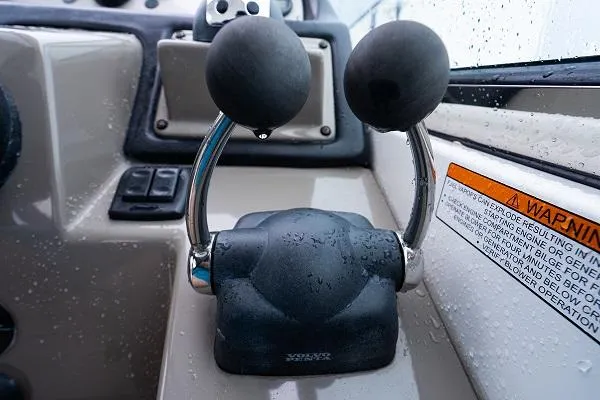  Yacht Photos Pics Throttle controls of a 2008 Cruisers 420 Express boat, with visible warning label.