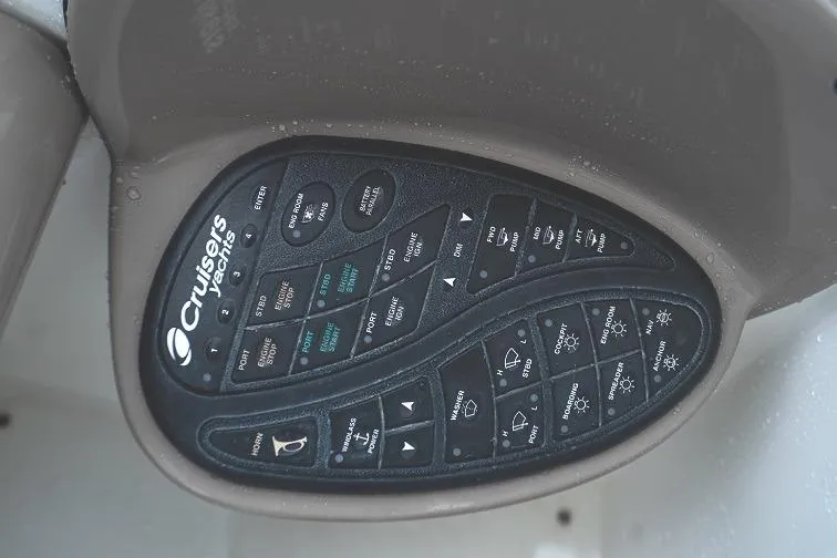  Yacht Photos Pics Control panel of a 2008 Cruisers 420 Express boat with various labeled buttons.