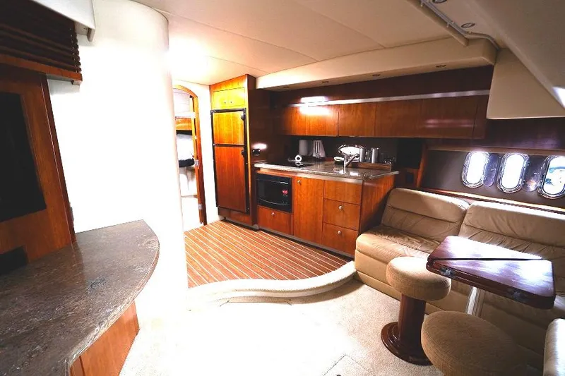  Yacht Photos Pics Interior of 2008 Cruisers 420 Express yacht with modern kitchen and seating area.