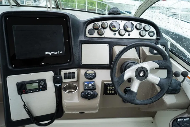  Yacht Photos Pics 2008 Cruisers 420 Express helm with Raymarine display and control panel.