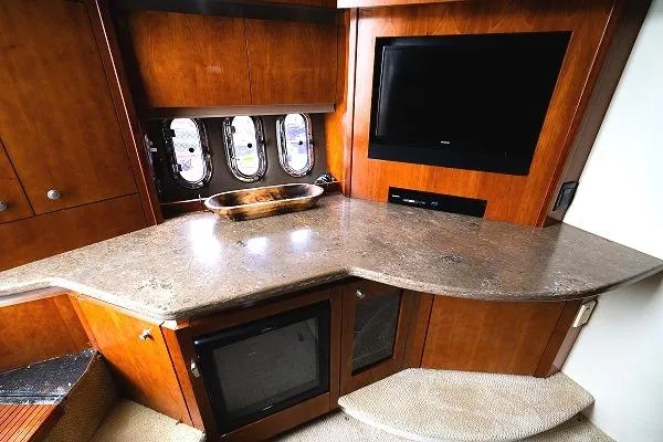  Yacht Photos Pics 2008 Cruisers 420 Express yacht interior with TV, countertop, and portholes.