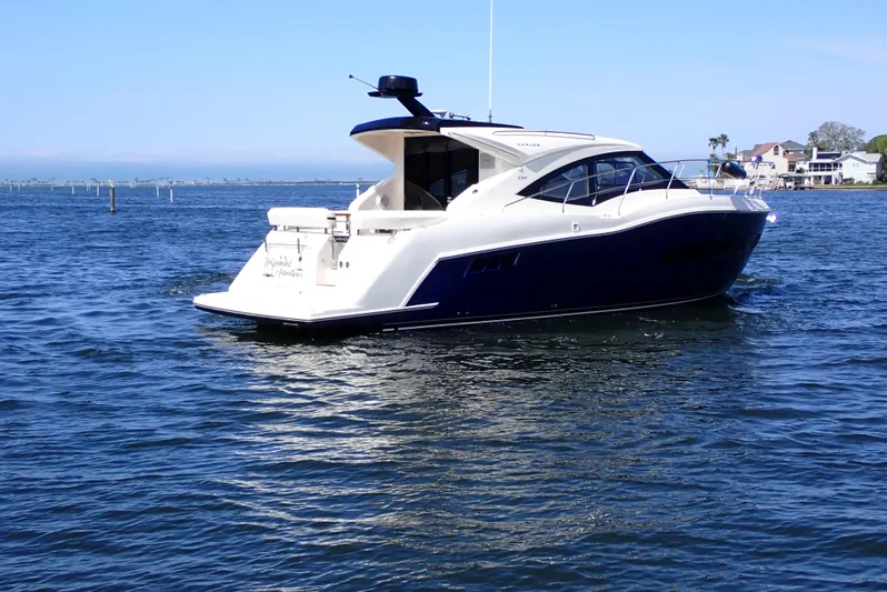  Yacht Photos Pics 2019 Carver C37 Coupe yacht cruising on a sunny day in open water.