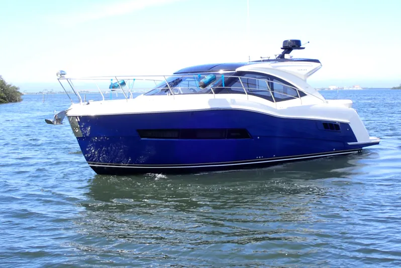  Yacht Photos Pics 2019 Carver C37 Coupe yacht on calm water, showcasing sleek design and modern features.