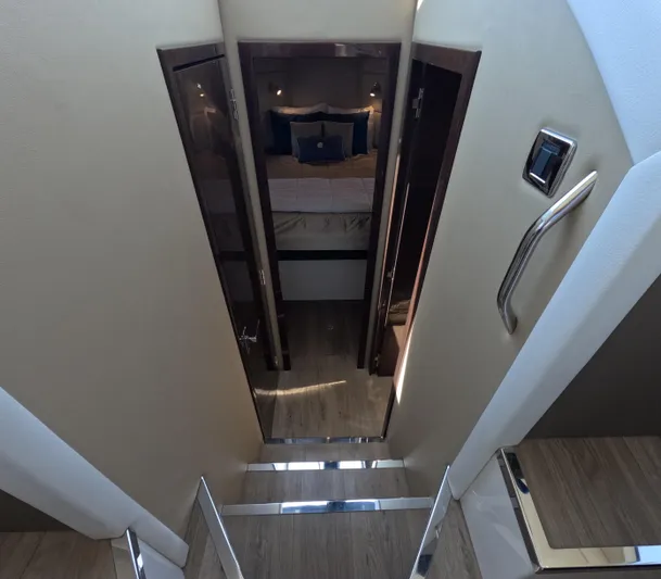  Yacht Photos Pics Interior of 2019 Carver C37 Coupe, featuring stairs leading to a cozy bedroom.
