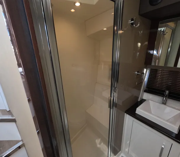  Yacht Photos Pics Modern bathroom interior in 2019 Carver C37 Coupe yacht, featuring a sleek shower and sink.