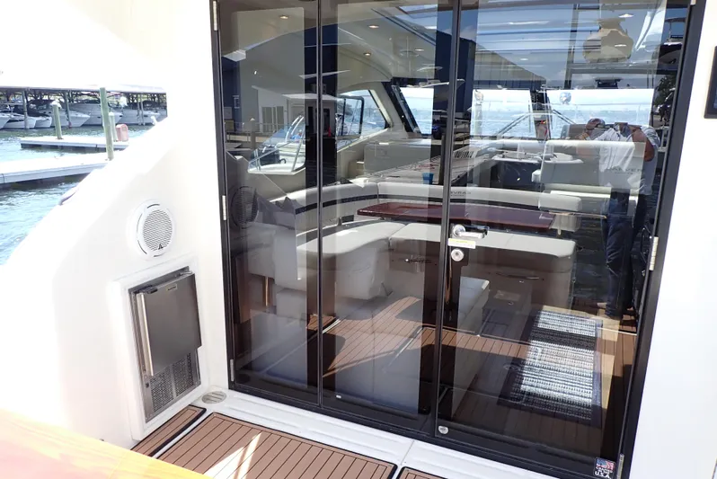  Yacht Photos Pics 2019 Carver C37 Coupe yacht interior with glass doors and luxurious seating.