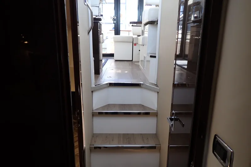  Yacht Photos Pics Interior view of 2019 Carver C37 Coupe yacht, featuring stairs leading to the main cabin.