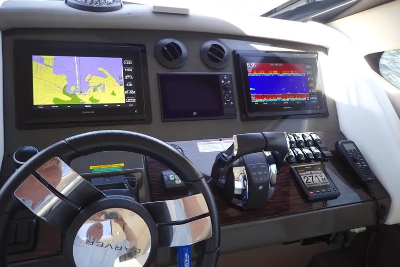  Yacht Photos Pics Dashboard of 2019 Carver C37 Coupe with navigation and control systems.