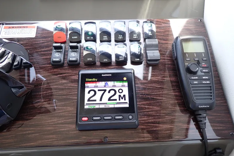  Yacht Photos Pics Control panel of a 2019 Carver C37 Coupe with Garmin navigation and communication devices.