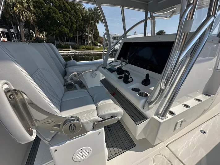 Knot Free Yacht Photos Pics Interior of 2021 SeaHunter 46 CTS boat with modern helm and seating.