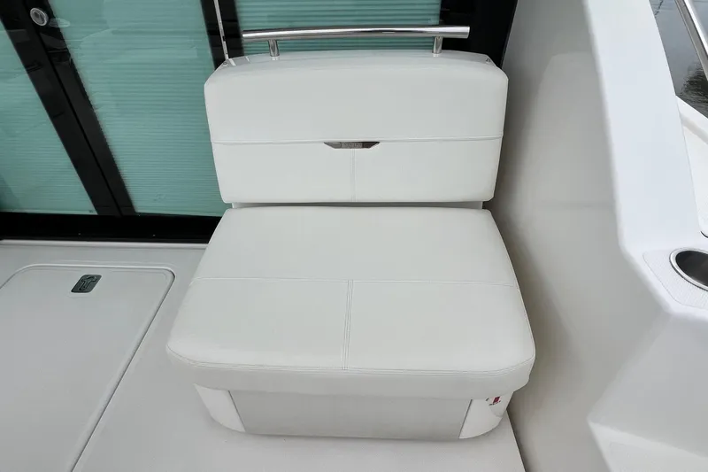 Salty Suite Yacht Photos Pics 2023 Tiara Yachts C44 Coupe white seating area with sleek design and modern finish.