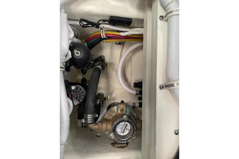 Salty Suite Yacht Photos Pics Engine compartment of 2023 Tiara Yachts C44 Coupe with visible wiring and components.