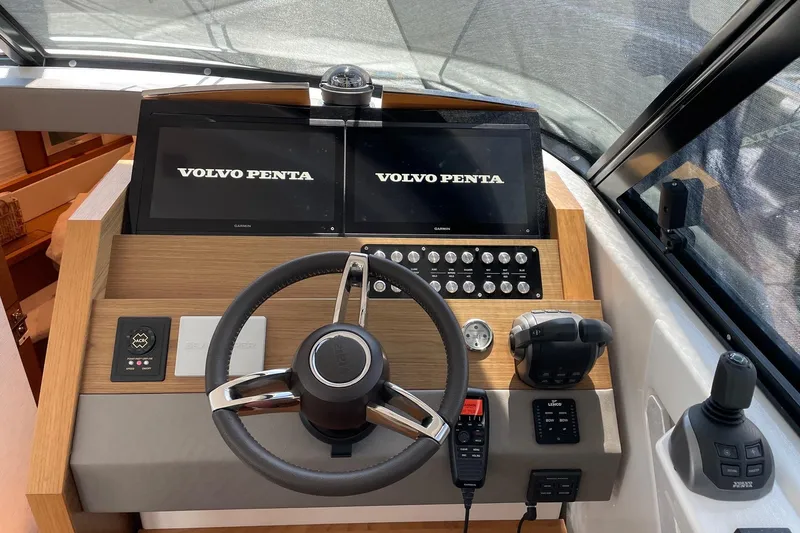 Salty Suite Yacht Photos Pics 2023 Tiara Yachts C44 Coupe helm with Volvo Penta displays and controls.