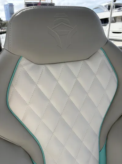 Hull 106 Yacht Photos Pics Luxurious seat detail on 2025 Hammer Yachts HammerCat 30, featuring diamond stitching and elegant design.