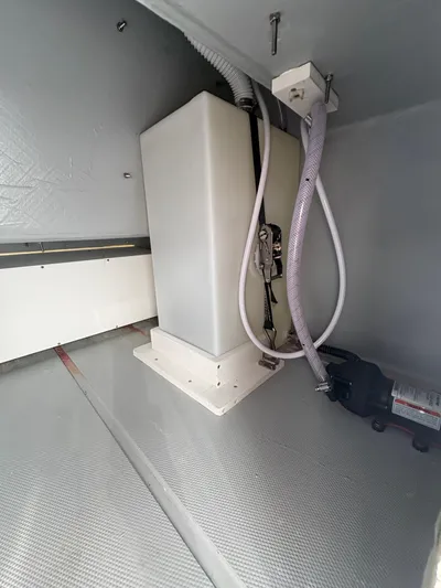 Hull 106 Yacht Photos Pics Interior view of 2025 Hammer Yachts HammerCat 30, showcasing utility compartment with hoses and equipment.