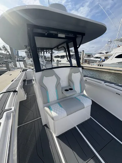 Hull 106 Yacht Photos Pics 2025 Hammer Yachts HammerCat 30 with sleek seating and modern design at a marina.