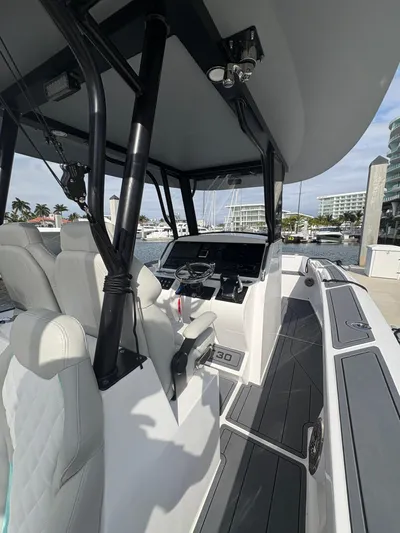 Hull 106 Yacht Photos Pics 2025 Hammer Yachts HammerCat 30 interior with modern helm and seating at marina.