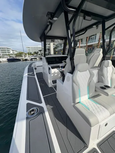 Hull 106 Yacht Photos Pics 2025 Hammer Yachts HammerCat 30 with sleek design and modern seating on the water.