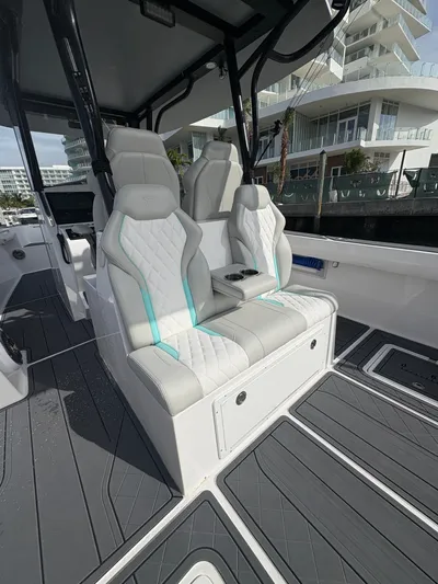 Hull 106 Yacht Photos Pics Luxury seating on 2025 Hammer Yachts HammerCat 30, featuring modern design and waterfront view.
