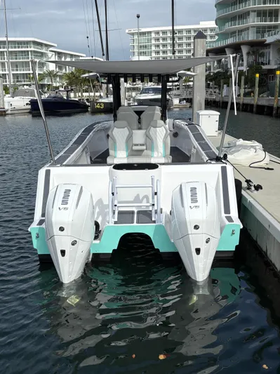 Hull 106 Yacht Photos Pics 2025 Hammer Yachts HammerCat 30 docked, featuring dual outboard engines and modern design.