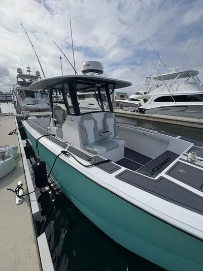 Hull 106 Yacht Photos Pics 2025 Hammer Yachts HammerCat 30 docked, showcasing sleek design and modern features.