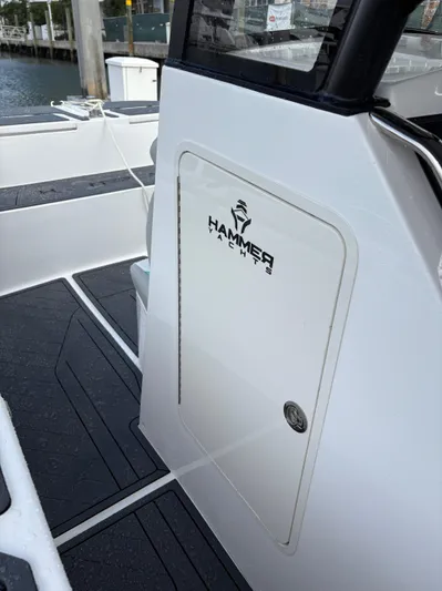 Hull 106 Yacht Photos Pics 2025 Hammer Yachts HammerCat 30, sleek design, docked at marina.